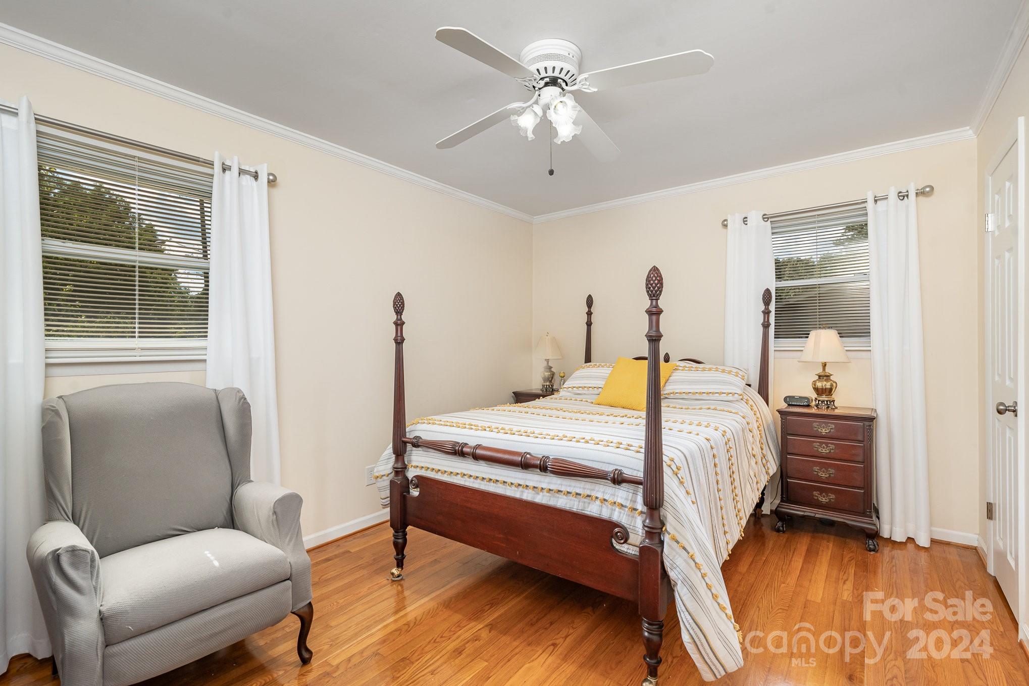 6308 Sunset Circle Charlotte, NC 28216 - Photo 19 of 30 a bedroom with a bed couch and a window