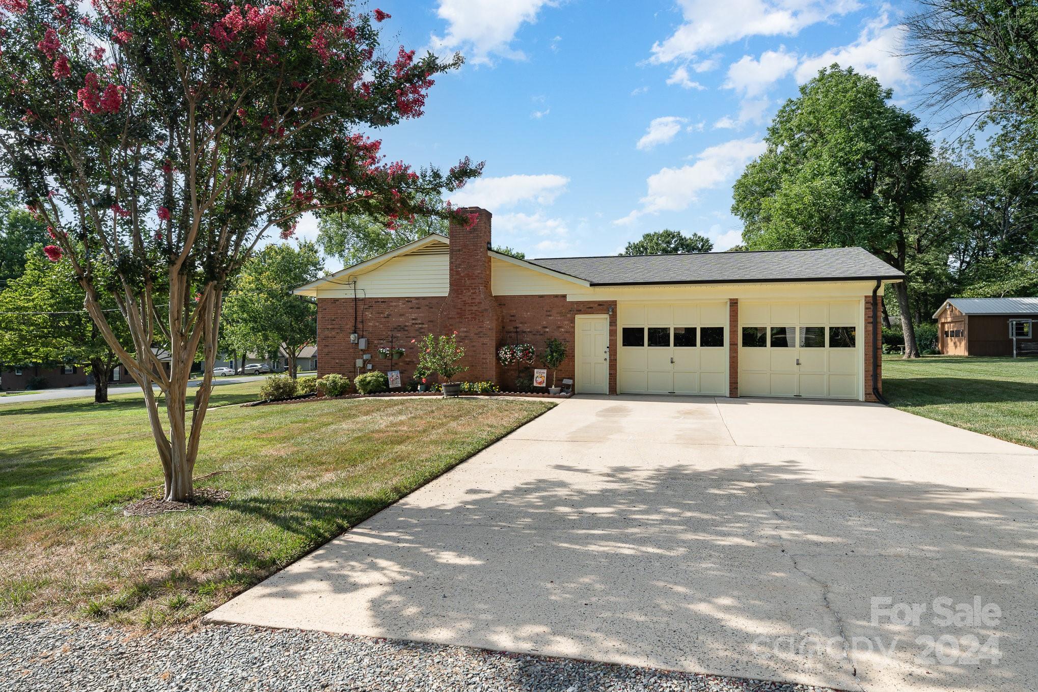 6308 Sunset Circle Charlotte, NC 28216 - Photo 21 of 30 a front view of a house with a yard