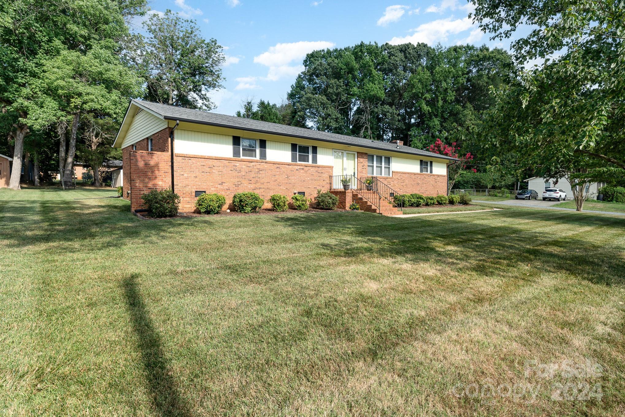 6308 Sunset Circle Charlotte, NC 28216 - Photo 25 of 30 a front view of house with yard and green space