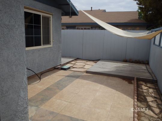 412 North Mono Street Ridgecrest, CA 93555 - Photo 6 of 50 a bedroom with a bed and a window