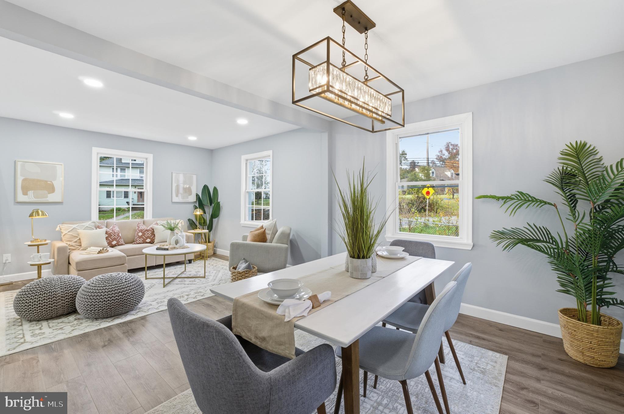 6 New County Road Aberdeen, MD 21001 - Photo 11 of 44 a living room with furniture a chandelier and a dining room
