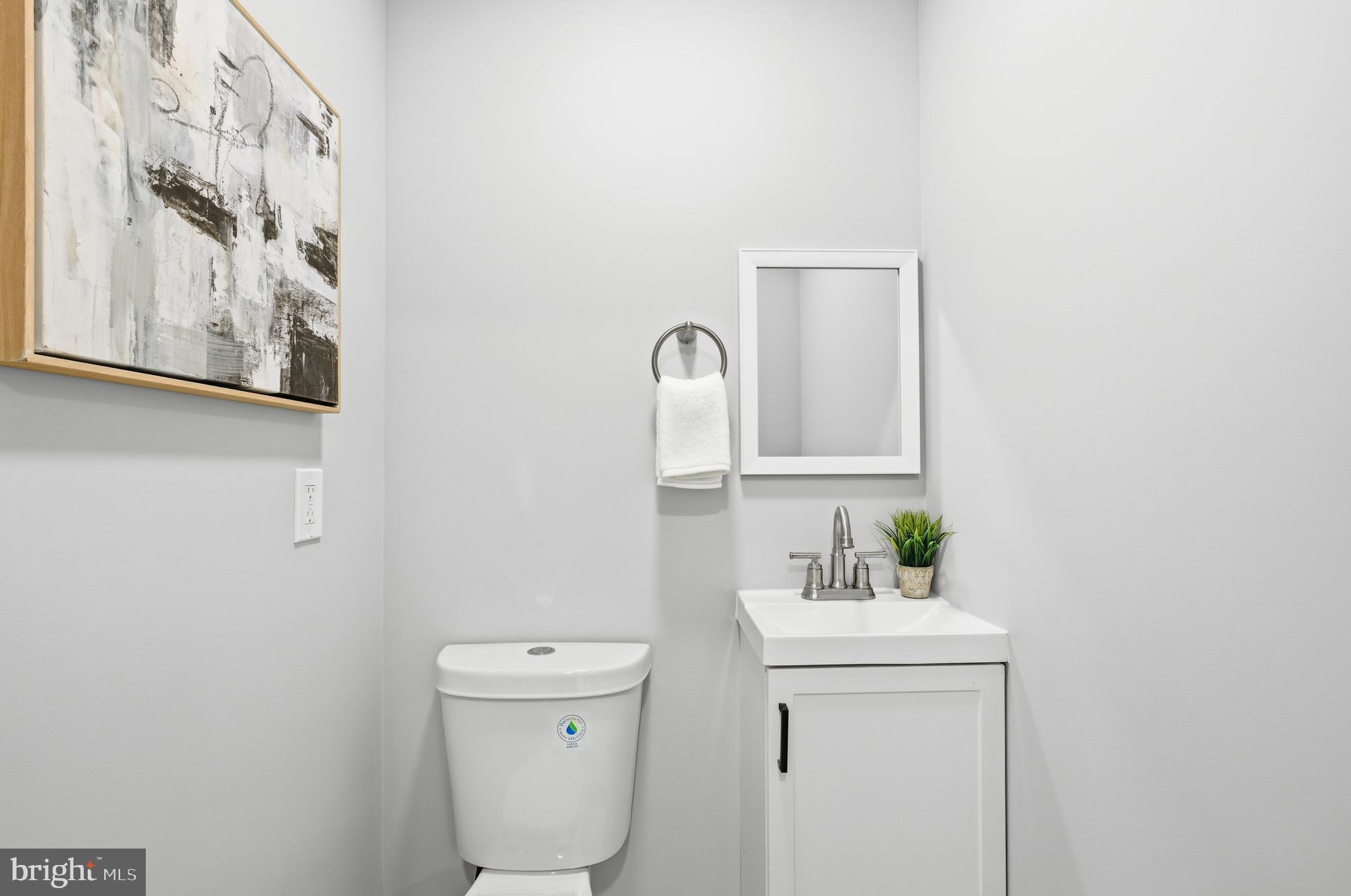 6 New County Road Aberdeen, MD 21001 - Photo 13 of 44 a bathroom with a toilet sink and mirror