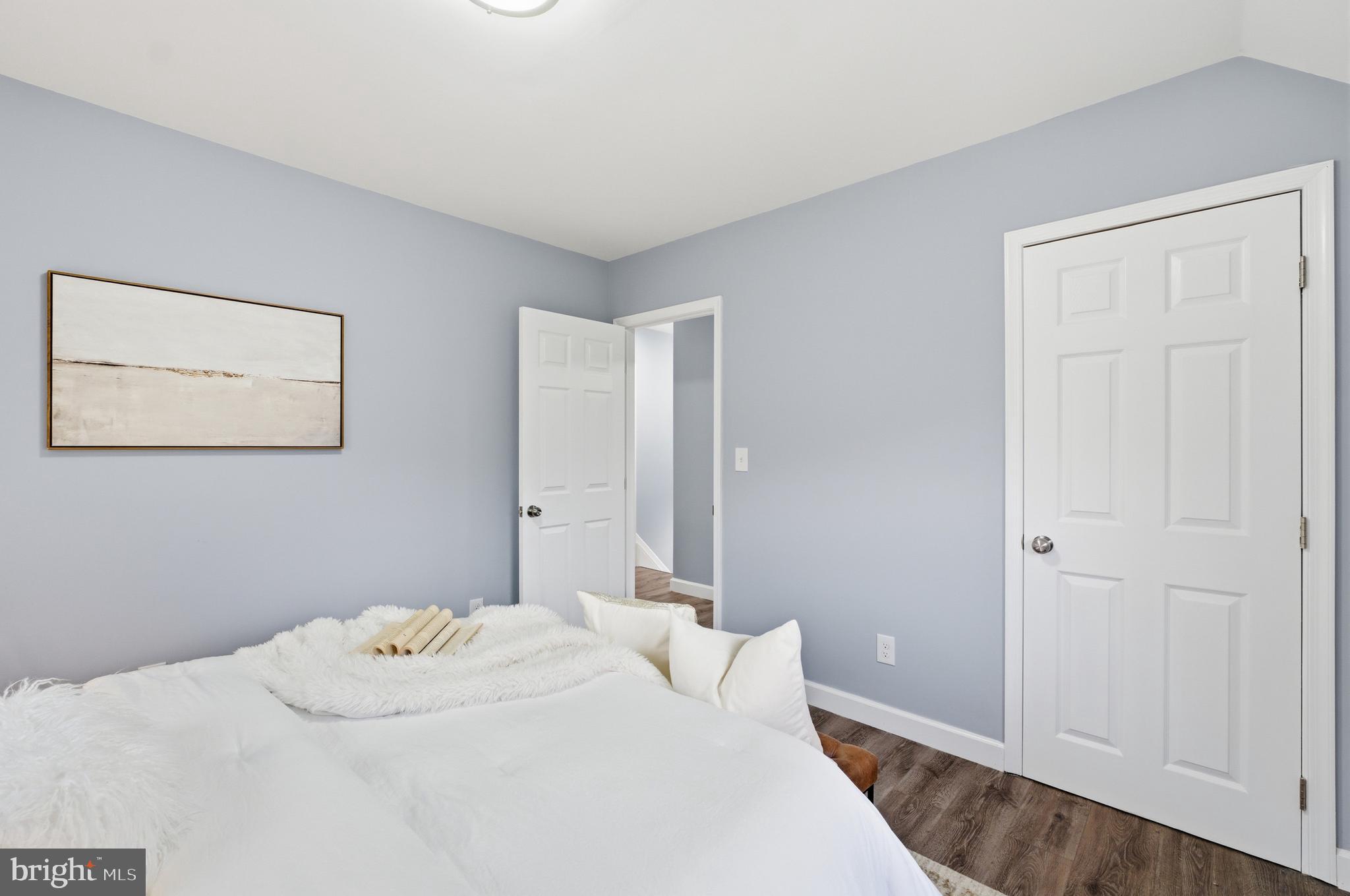 6 New County Road Aberdeen, MD 21001 - Photo 18 of 44 a bedroom with a bed and a painting on the wall