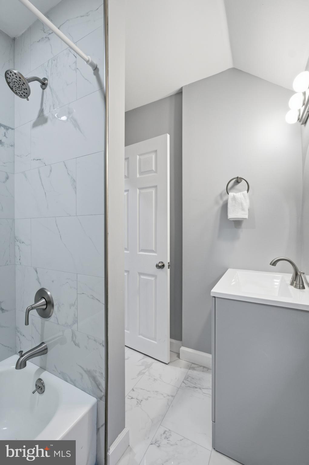 6 New County Road Aberdeen, MD 21001 - Photo 21 of 44 a bathroom with a sink a shower and a mirror