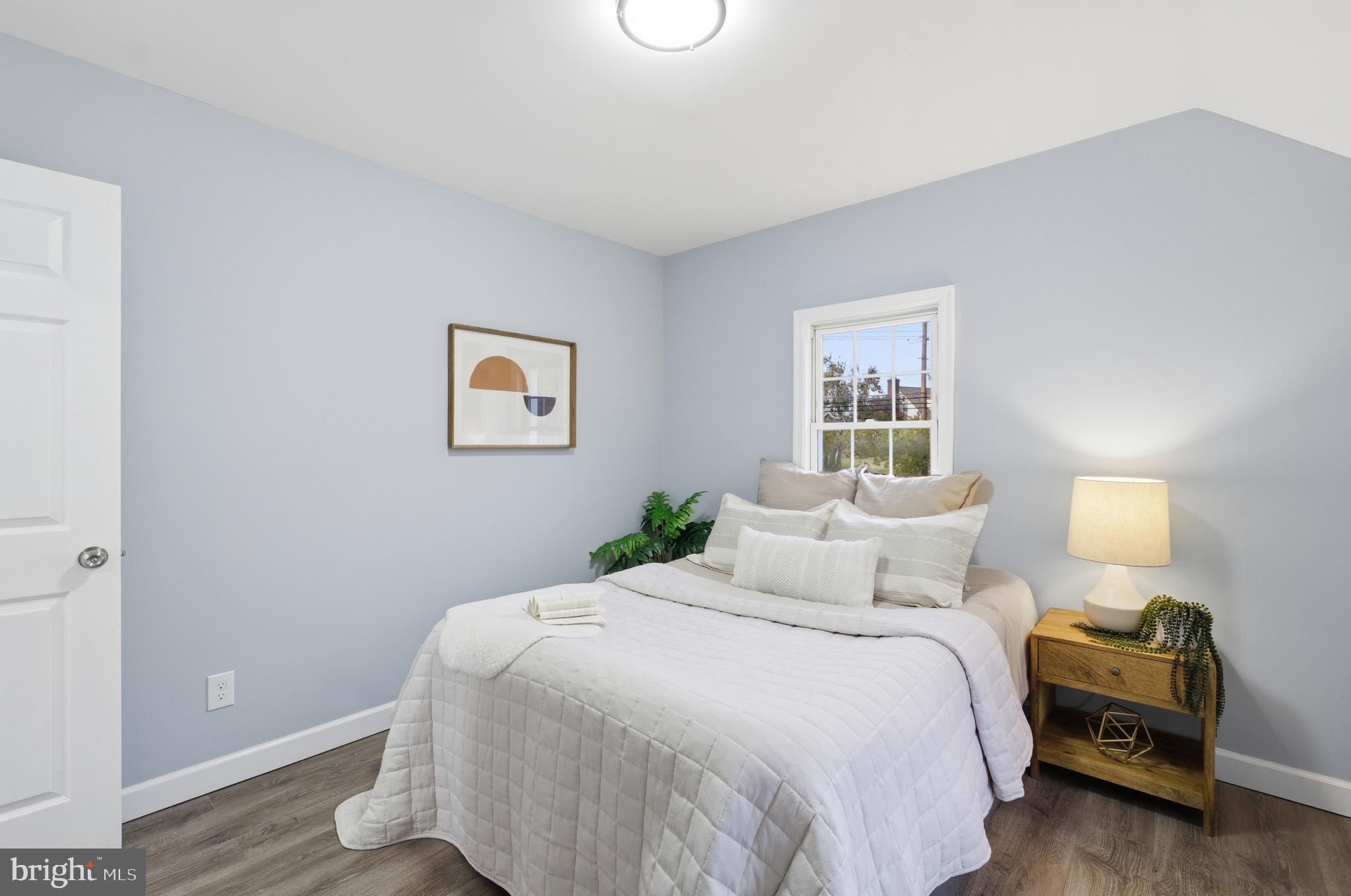 6 New County Road Aberdeen, MD 21001 - Photo 23 of 44 a bedroom with a bed and wooden floor