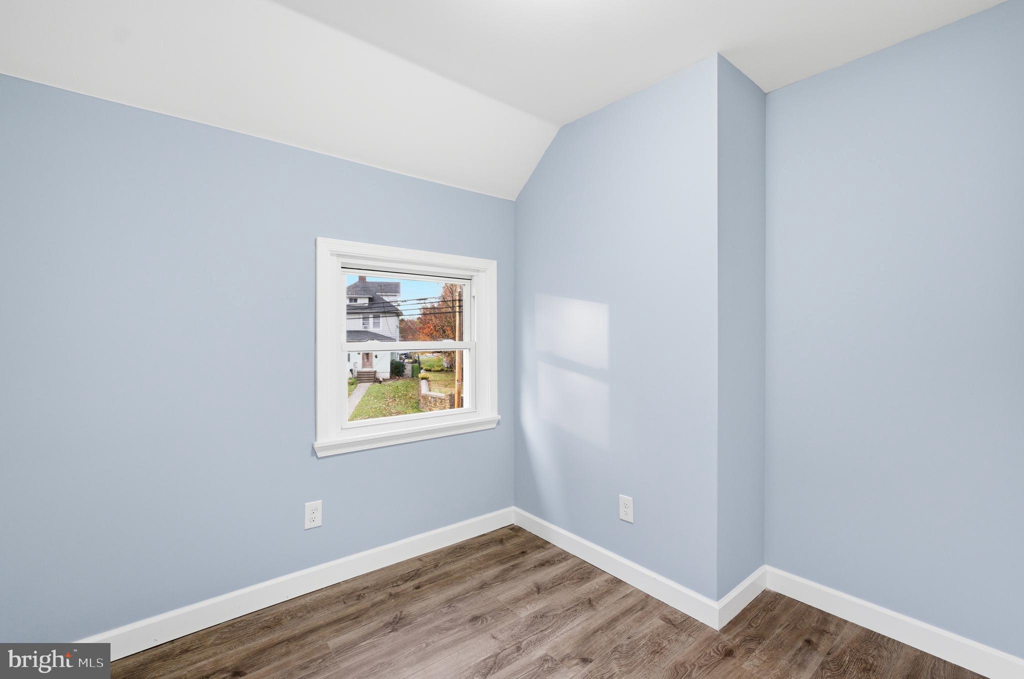 6 New County Road Aberdeen, MD 21001 - Photo 25 of 44 a view of an empty room with wooden floor and a window