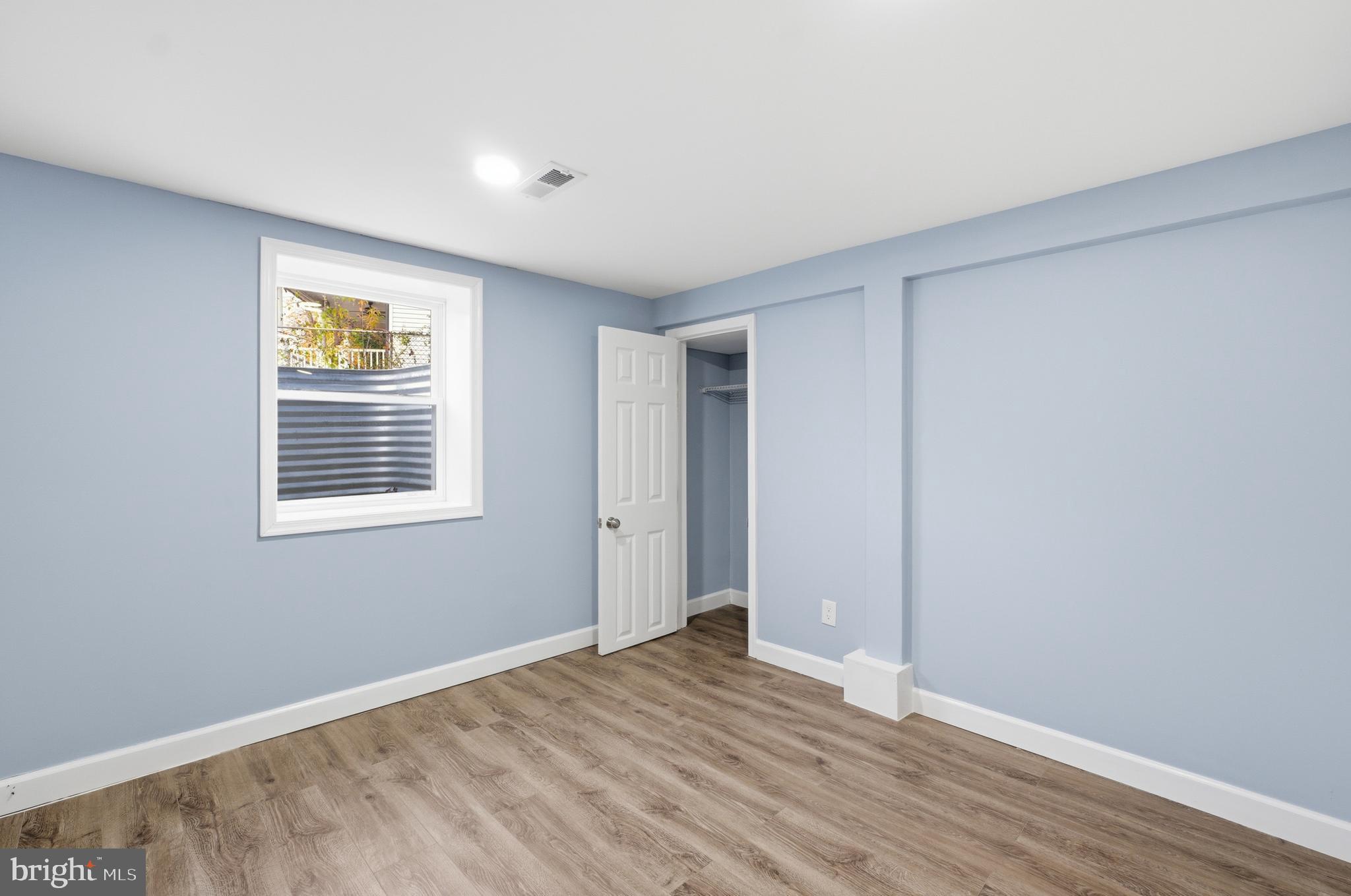 6 New County Road Aberdeen, MD 21001 - Photo 29 of 44 a view of an empty room with wooden floor and a window