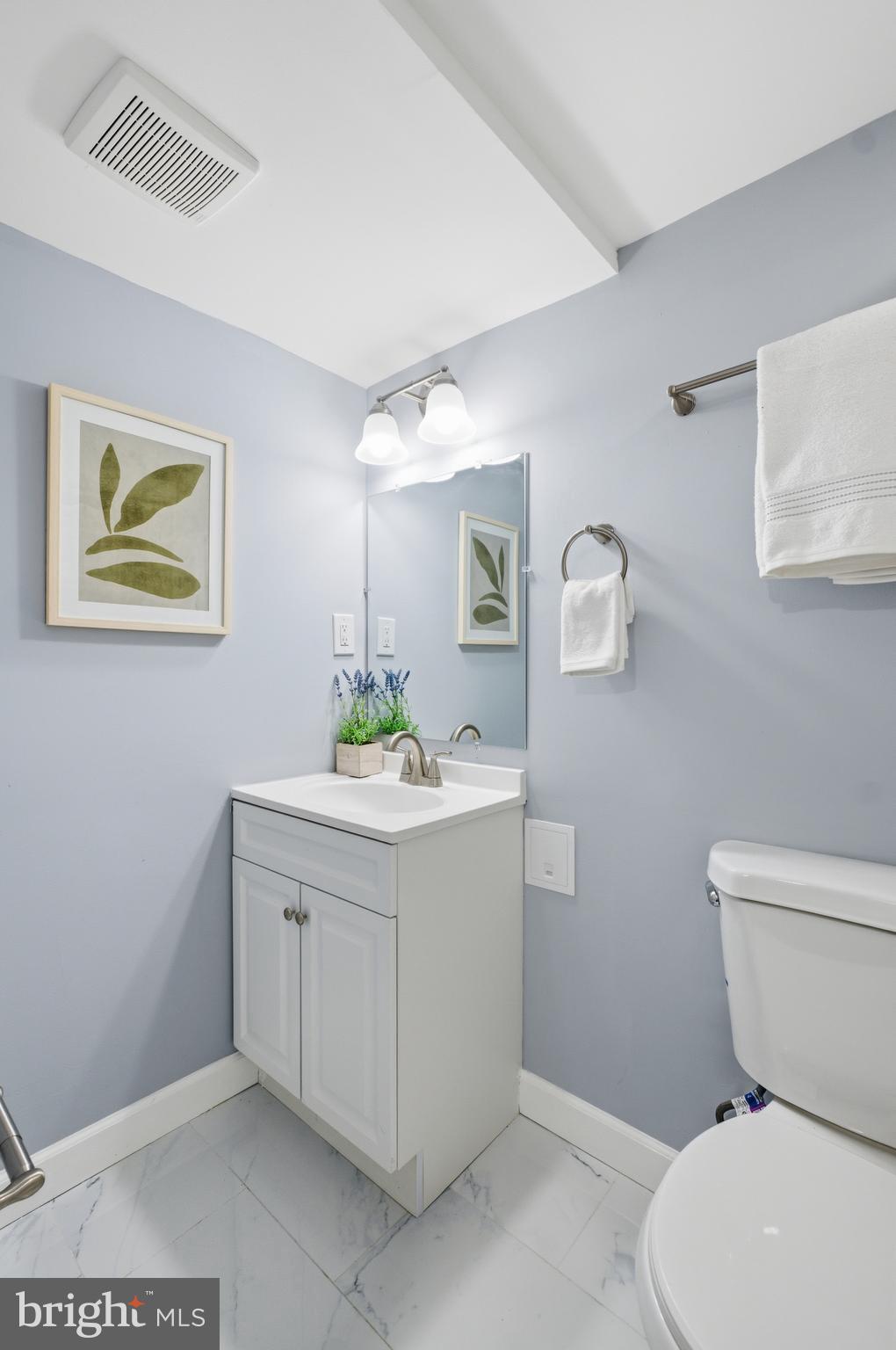 6 New County Road Aberdeen, MD 21001 - Photo 30 of 44 a bathroom with a toilet a sink and mirror