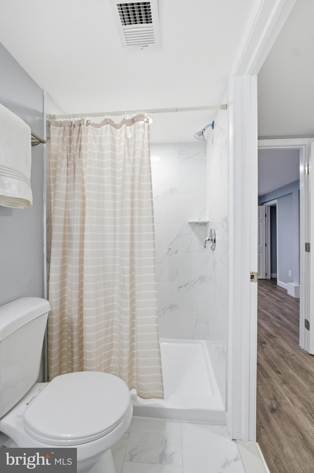 6 New County Road Aberdeen, MD 21001 - Photo 32 of 44 a white toilet sitting next to a bath tub and shower