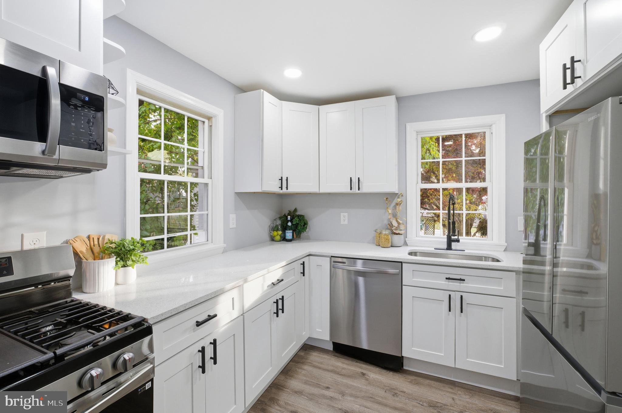 6 New County Road Aberdeen, MD 21001 - Photo 7 of 44 a kitchen with cabinets appliances a sink and a window