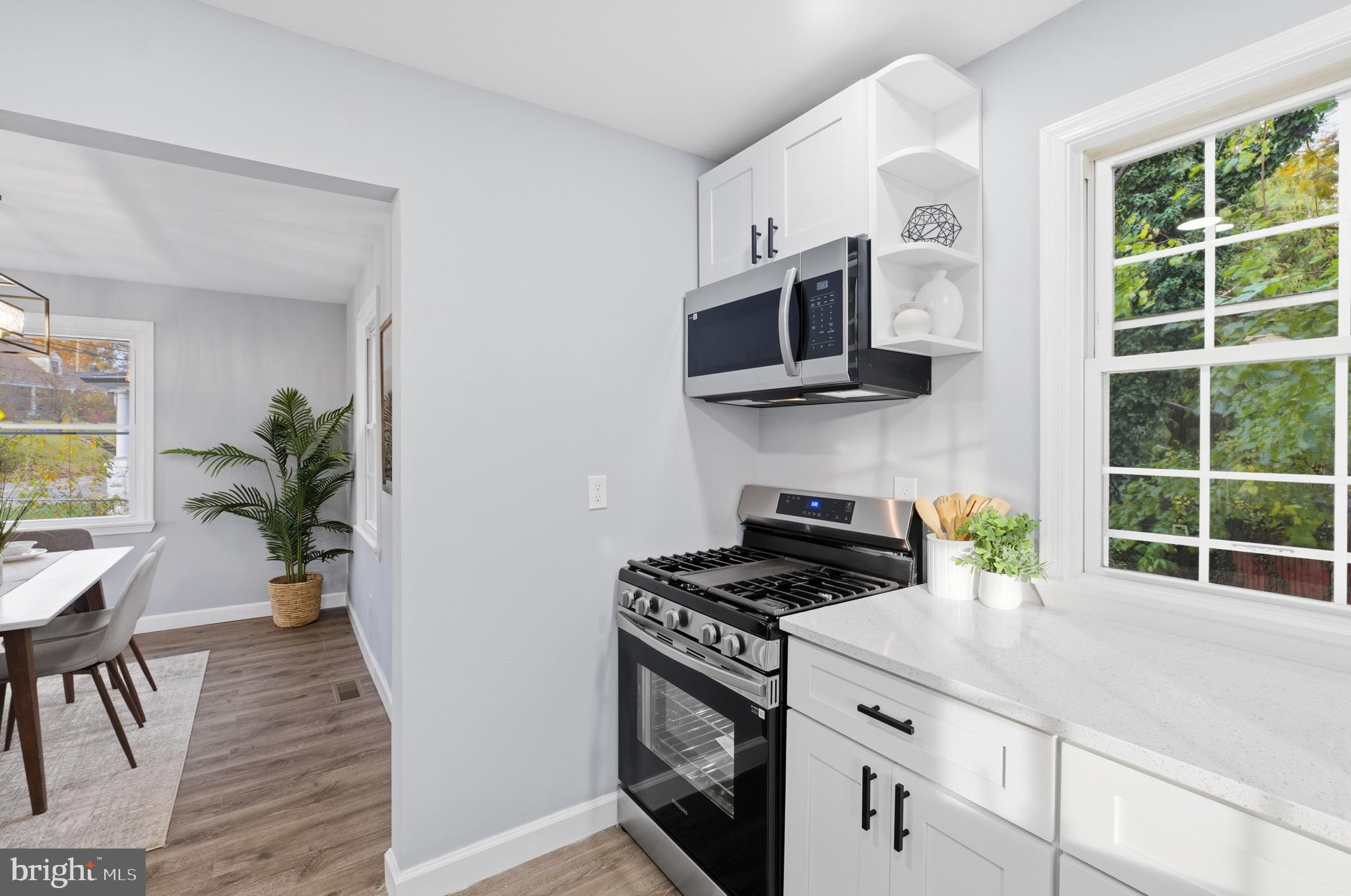 6 New County Road Aberdeen, MD 21001 - Photo 8 of 44 a kitchen with stainless steel appliances a stove a microwave sink and cabinets
