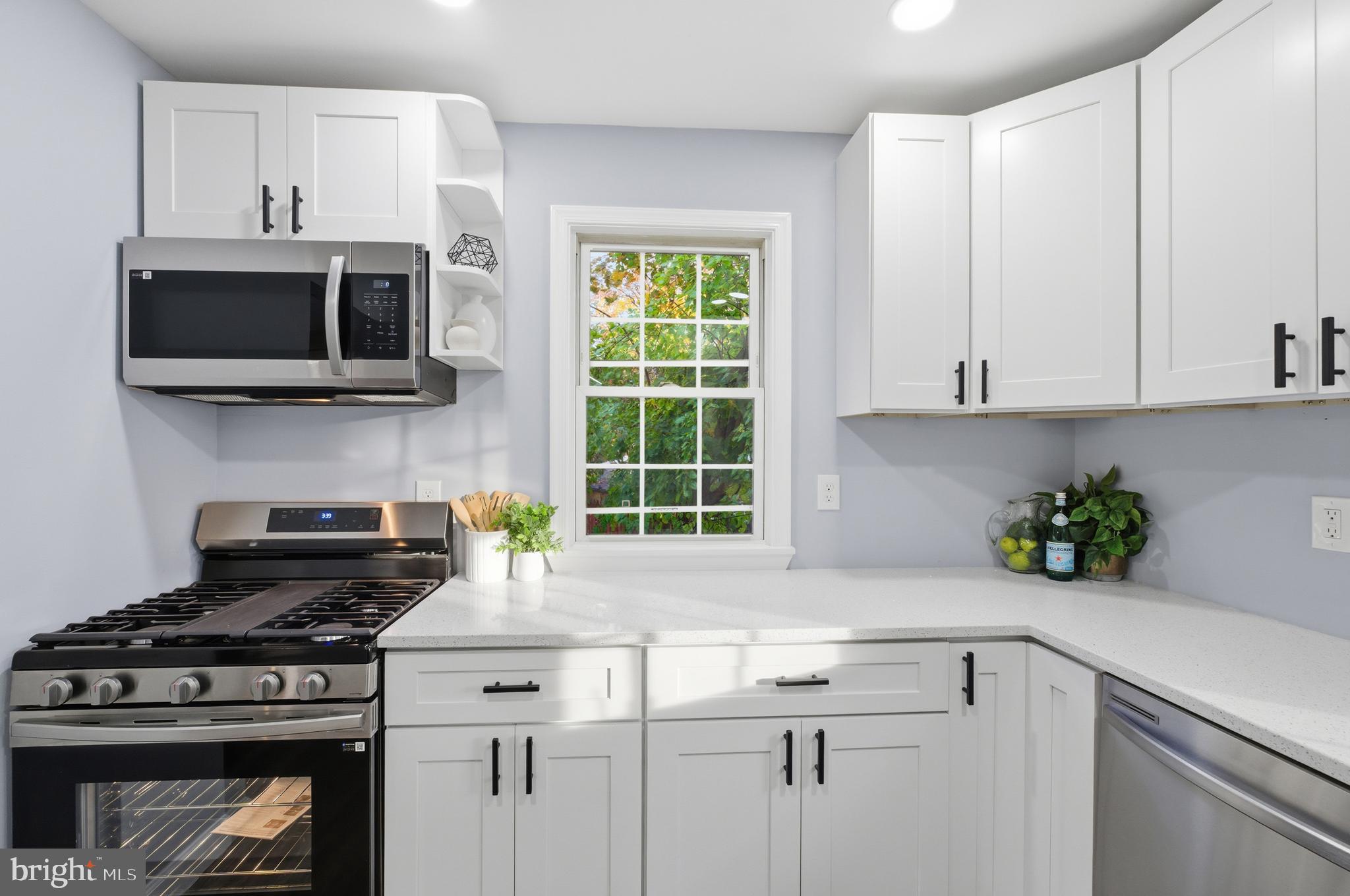 6 New County Road Aberdeen, MD 21001 - Photo 9 of 44 a kitchen with a stove and a white cabinets