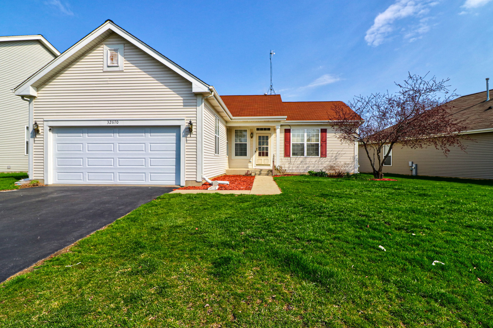 32670 Innetowne Road Lakemoor, IL 60051 - Photo 1 of 25 a front view of house with yard and green space