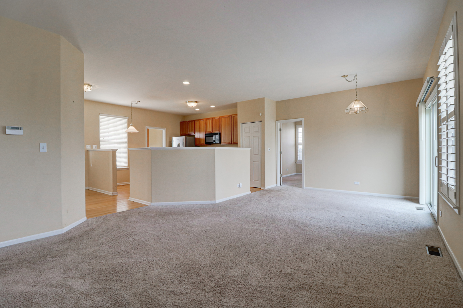 32670 Innetowne Road Lakemoor, IL 60051 - Photo 11 of 25 a view of a kitchen with a refrigerator and a window