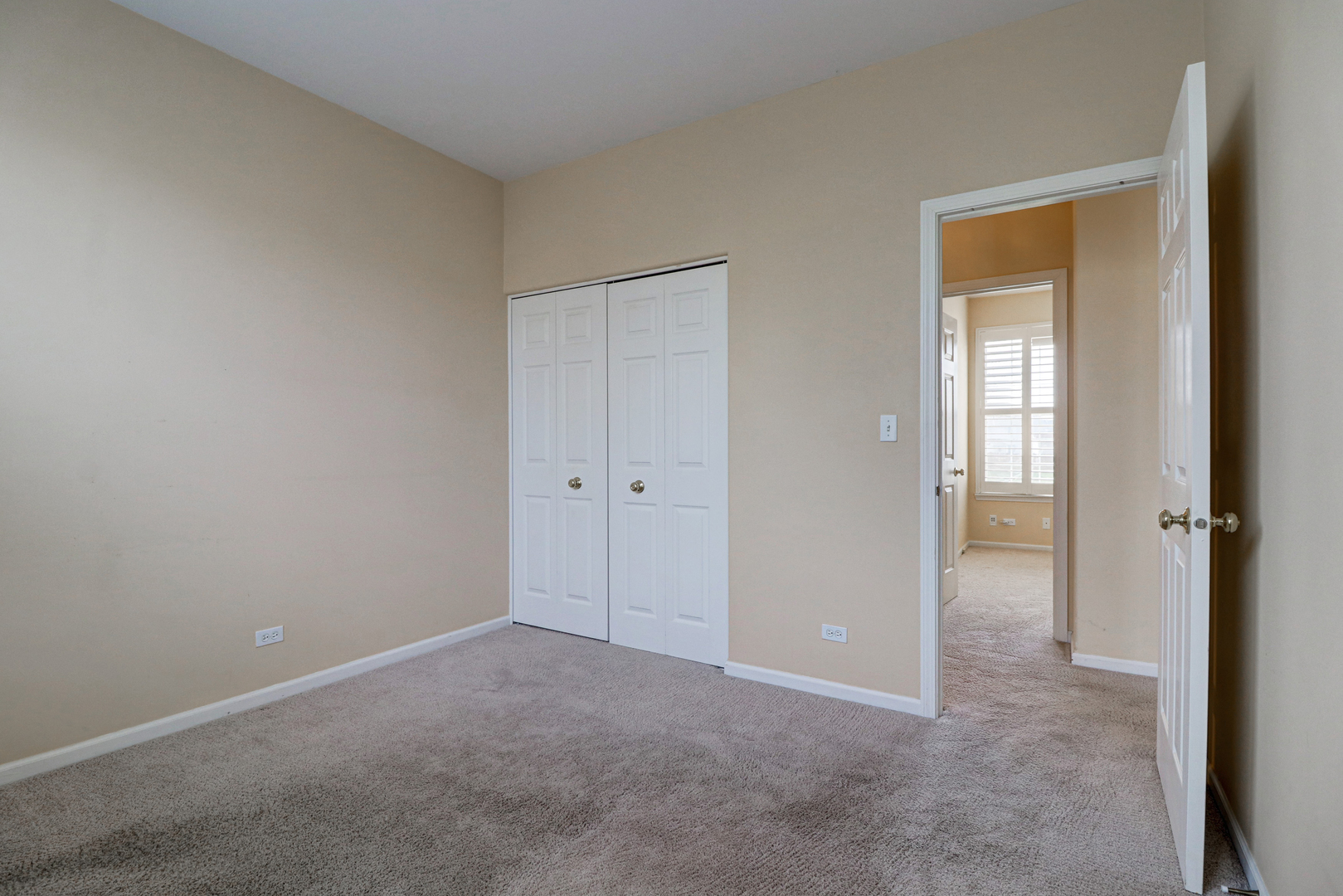32670 Innetowne Road Lakemoor, IL 60051 - Photo 13 of 25 a view of an empty room with closet and a window