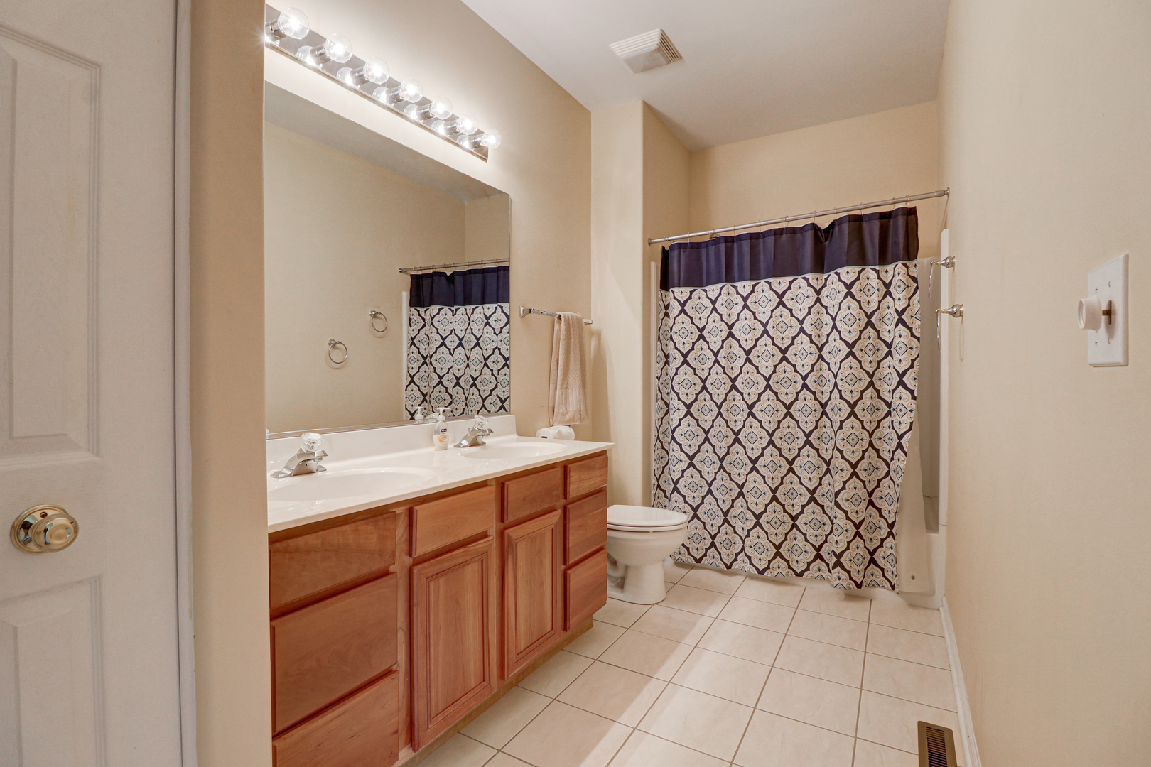 32670 Innetowne Road Lakemoor, IL 60051 - Photo 14 of 25 a bathroom with a sink a toilet and shower