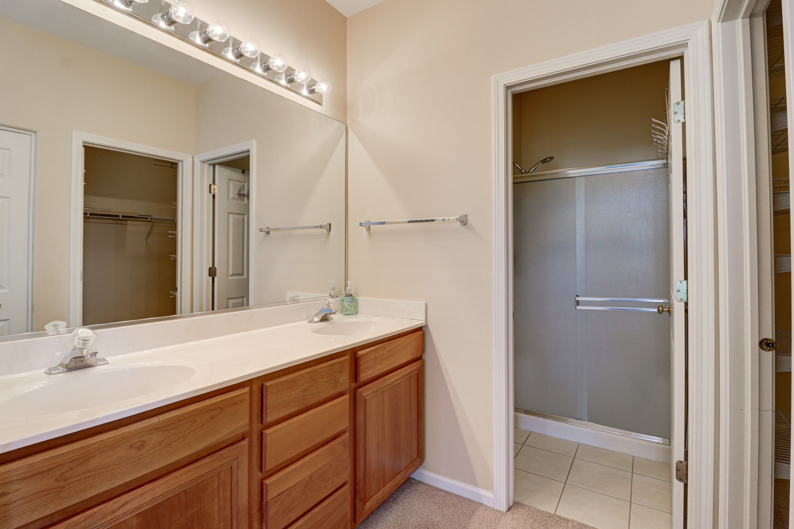 32670 Innetowne Road Lakemoor, IL 60051 - Photo 20 of 25 a bathroom with a sink double vanity and a mirror