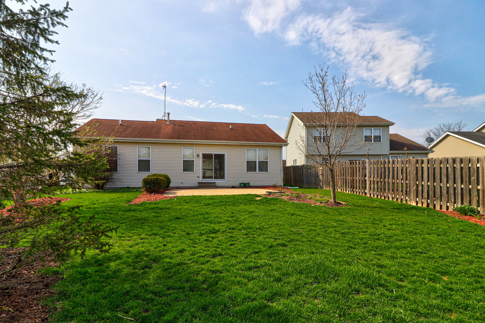 32670 Innetowne Road Lakemoor, IL 60051 - Photo 25 of 25 a front view of house with yard barbeque and outdoor seating