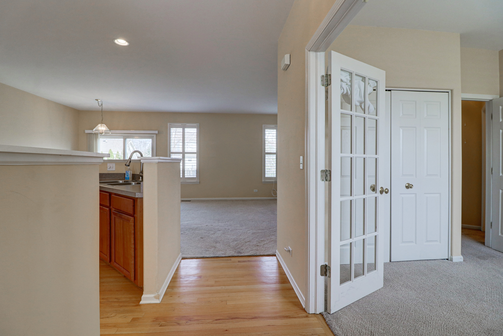32670 Innetowne Road Lakemoor, IL 60051 - Photo 3 of 25 a view of a hallway with wooden shelves