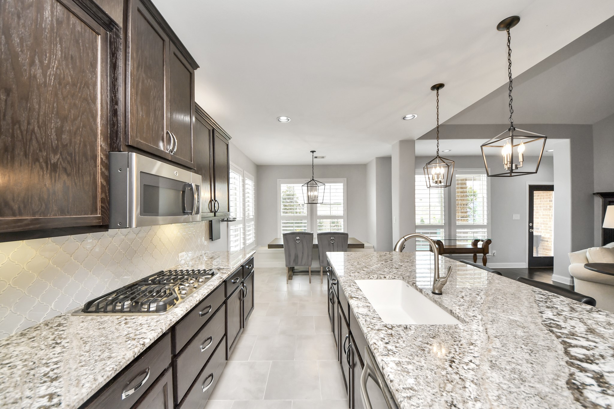 2811 Hadley Springs Lane Spring, TX 77386 - Photo 9 of 50 a large kitchen with kitchen island a large window a sink and stainless steel appliances