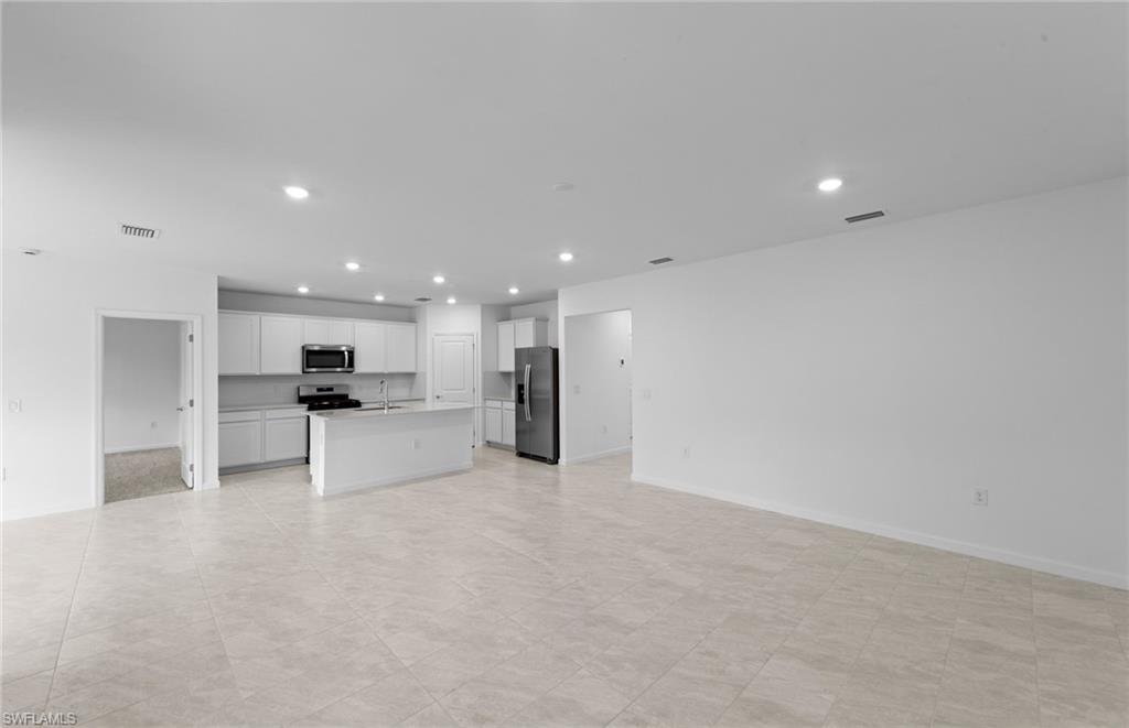 15887 Northridge Road Punta Gorda, FL 33982 - Photo 2 of 23 a view of kitchen with kitchen island a sink stainless steel appliances and cabinets