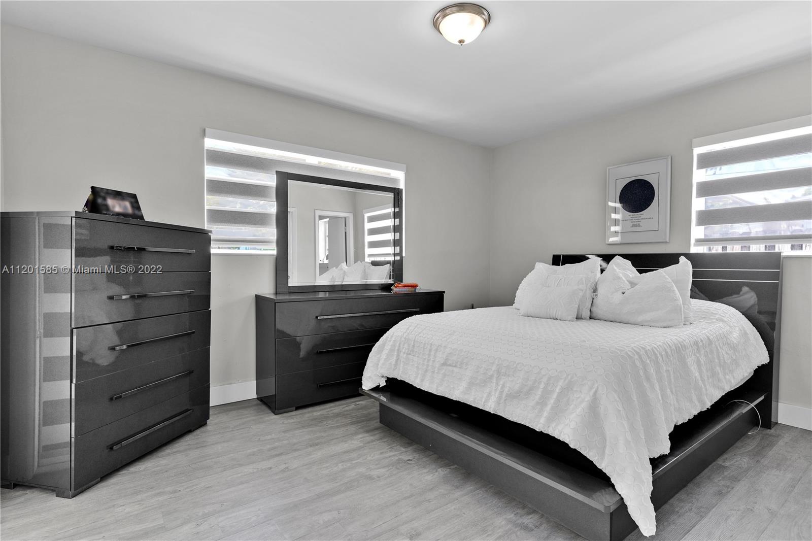19620 Franjo Road Cutler Bay, FL 33157 - Photo 16 of 28 a bedroom with a bed and a dresser
