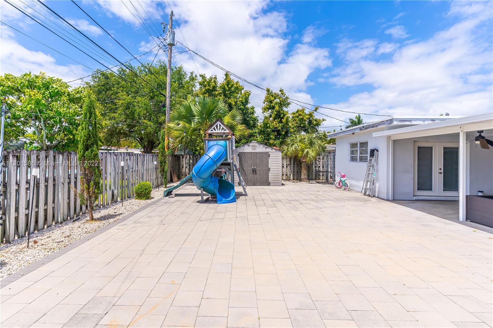 19620 Franjo Road Cutler Bay, FL 33157 - Photo 24 of 28 a view of a house with a yard and potted plants