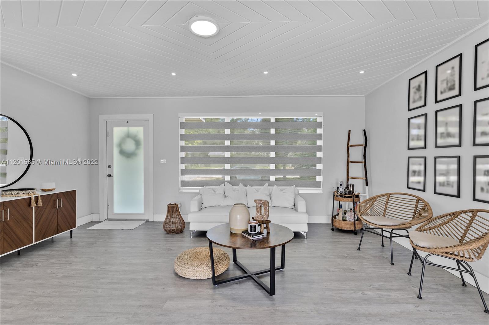 19620 Franjo Road Cutler Bay, FL 33157 - Photo 3 of 28 a living room with fireplace furniture and a large window