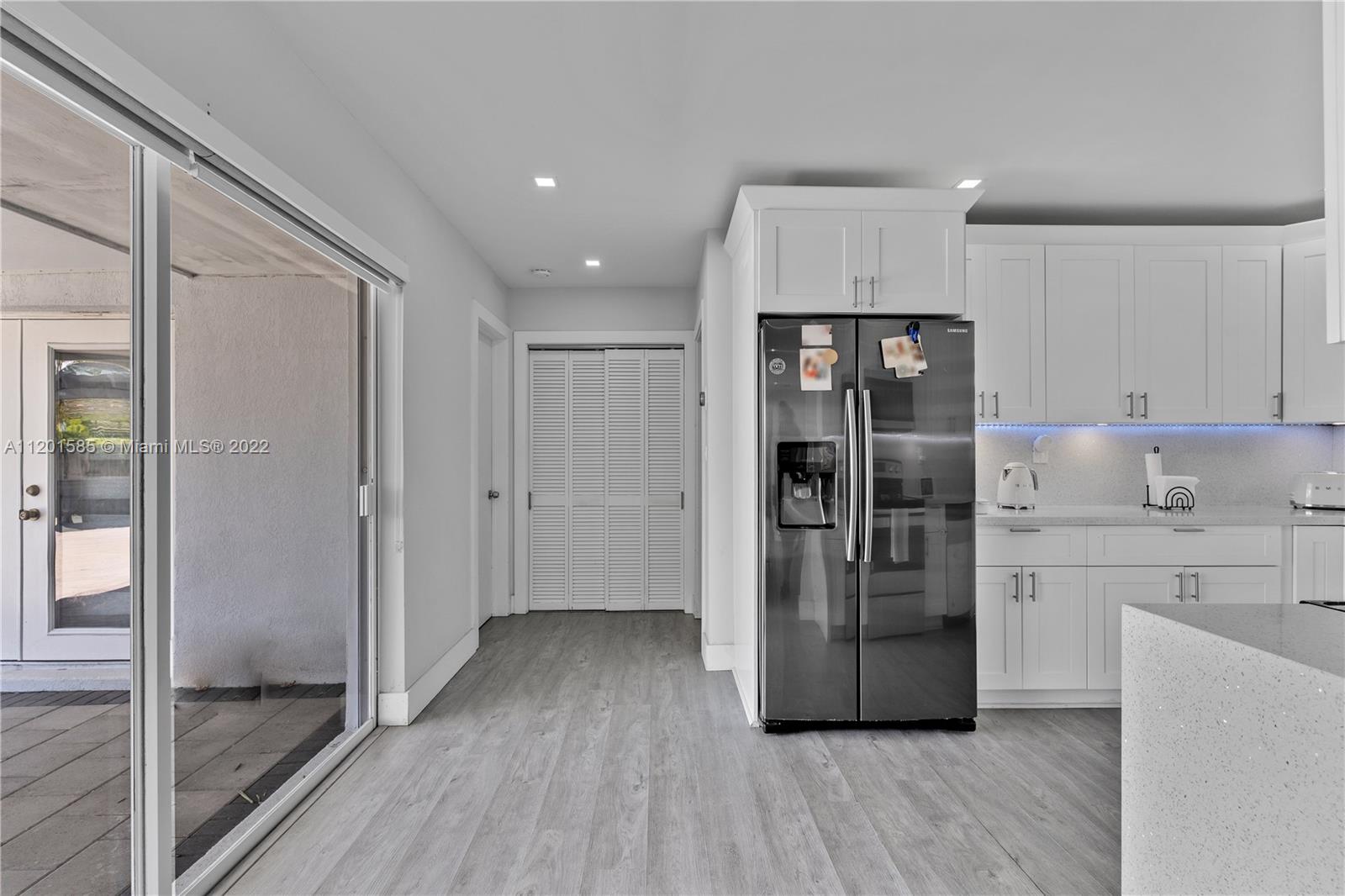 19620 Franjo Road Cutler Bay, FL 33157 - Photo 8 of 28 a kitchen with stainless steel appliances a refrigerator and a stove top oven