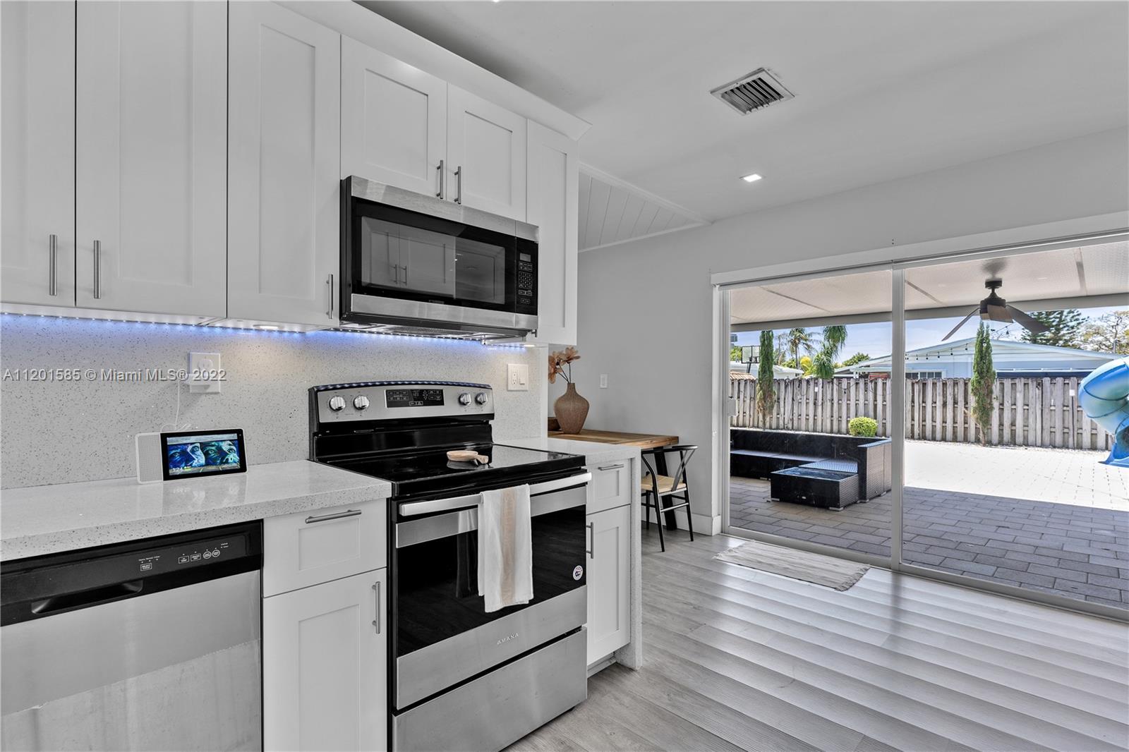 19620 Franjo Road Cutler Bay, FL 33157 - Photo 10 of 28 a kitchen with a stove and a microwave