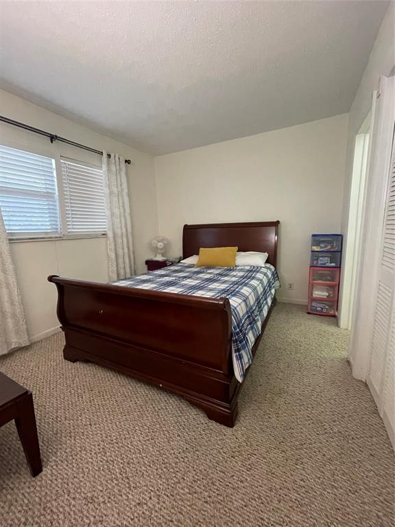2851 East Golf Boulevard, Unit 206 Pompano Beach, FL 33064 - Photo 13 of 35 a bedroom with a bed and window