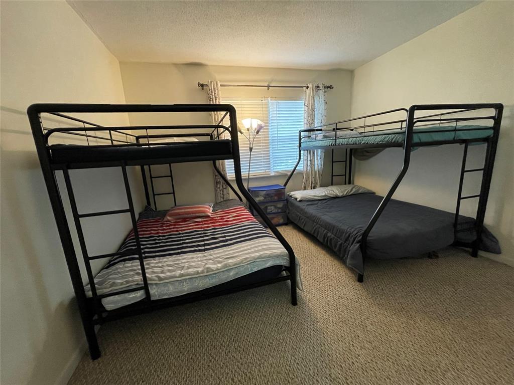 2851 East Golf Boulevard, Unit 206 Pompano Beach, FL 33064 - Photo 16 of 35 a bedroom with bunk bed