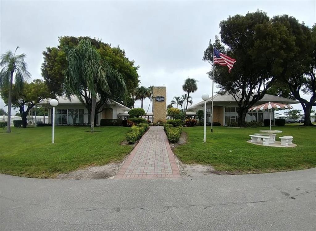 2851 East Golf Boulevard, Unit 206 Pompano Beach, FL 33064 - Photo 23 of 35 a view of a park with large trees