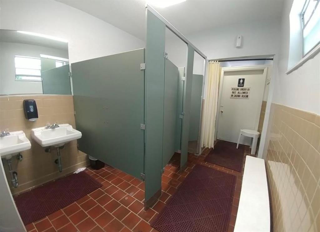 2851 East Golf Boulevard, Unit 206 Pompano Beach, FL 33064 - Photo 29 of 35 a bedroom with a bed and mirror