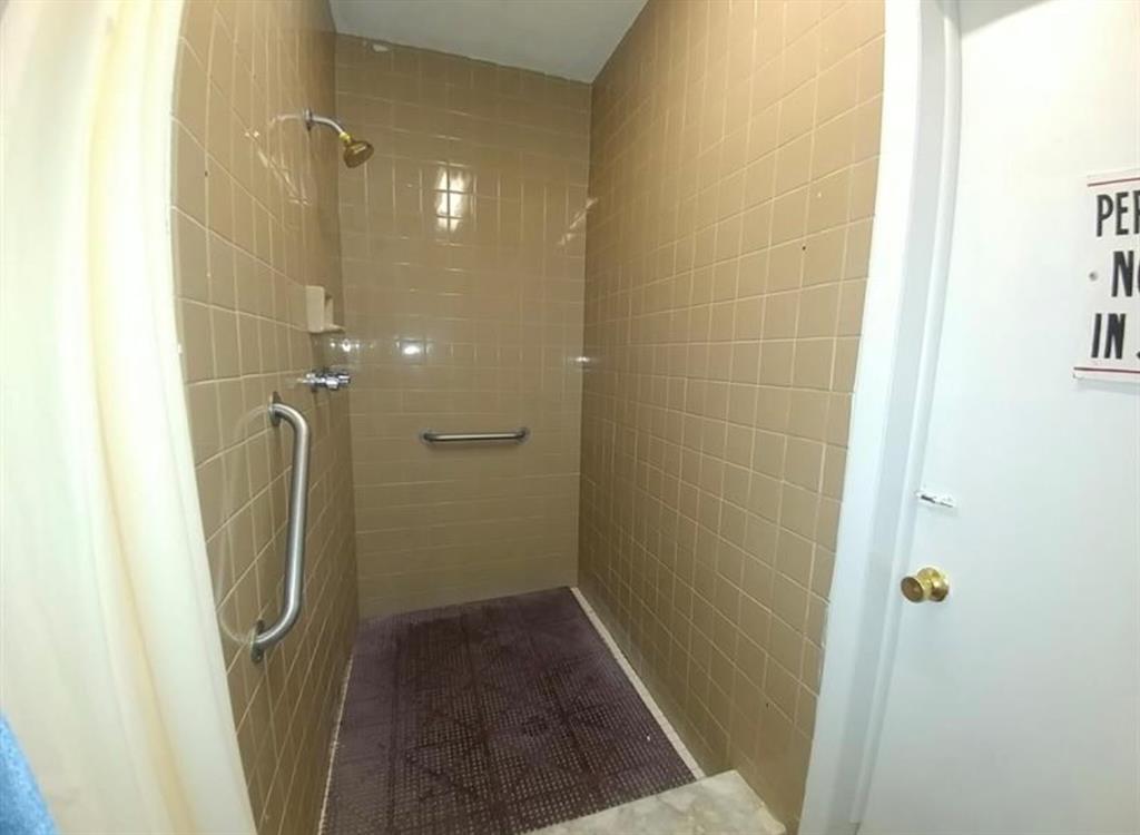 2851 East Golf Boulevard, Unit 206 Pompano Beach, FL 33064 - Photo 30 of 35 a bathroom with a shower