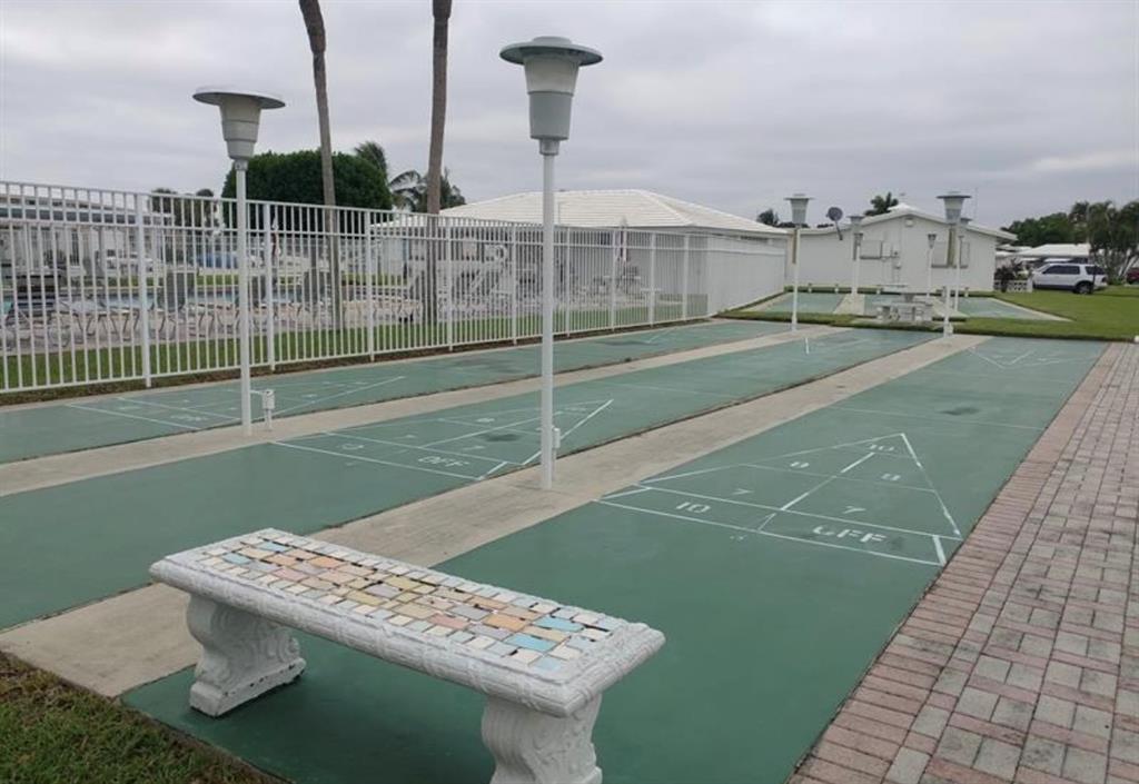 2851 East Golf Boulevard, Unit 206 Pompano Beach, FL 33064 - Photo 31 of 35 a view of a terrace with chairs
