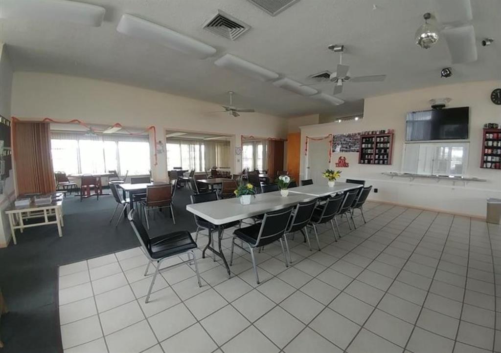 2851 East Golf Boulevard, Unit 206 Pompano Beach, FL 33064 - Photo 33 of 35 a view of a dining area with furniture