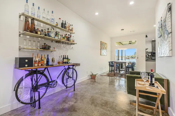 a kitchen with a table chairs sink and cabinets