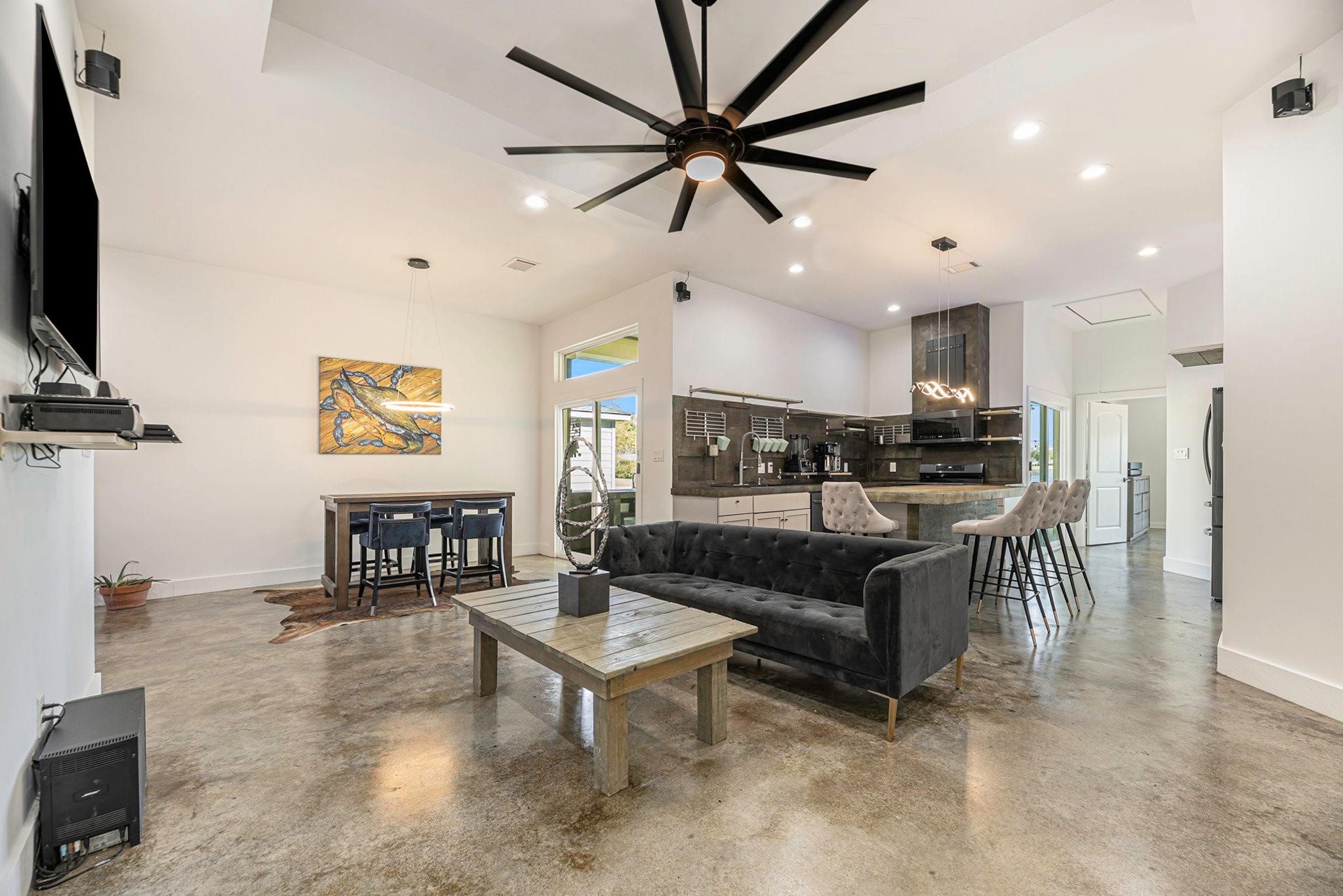 475 Pinnacle Trinity, TX 75862 - Photo 13 of 23 a living room with furniture a ceiling fan and a flat screen tv
