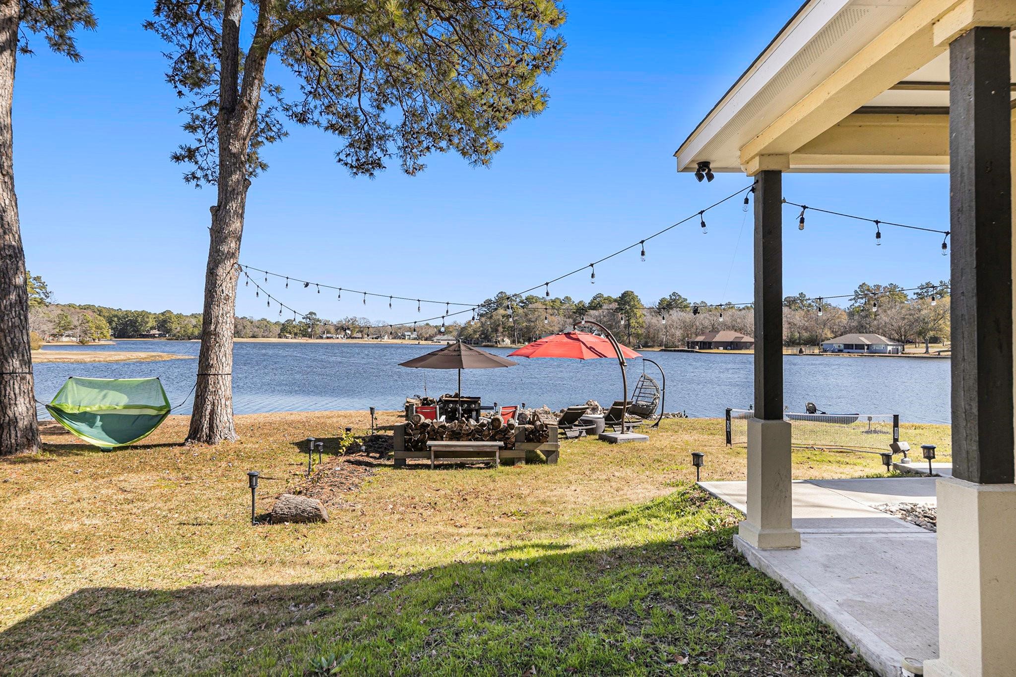 475 Pinnacle Trinity, TX 75862 - Photo 20 of 23 a view of a swimming pool with a lawn chairs