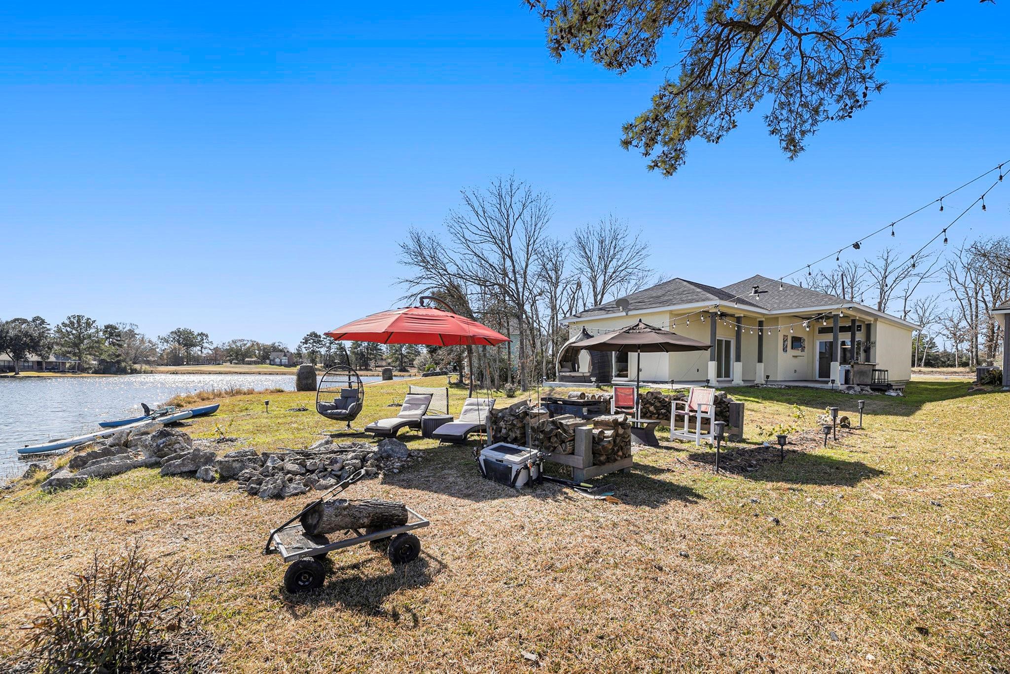 475 Pinnacle Trinity, TX 75862 - Photo 22 of 23 a group of lawn chairs under an umbrella