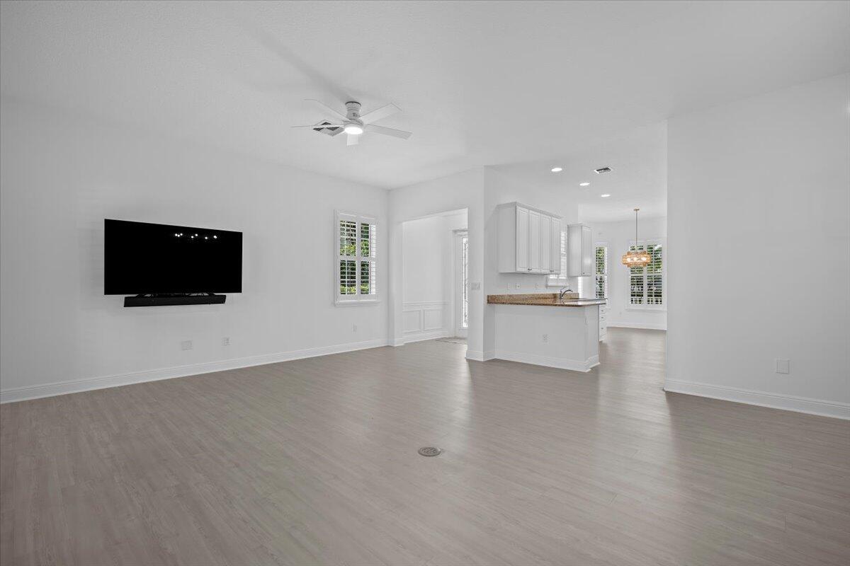 1041 Big Pine Way Jupiter, FL 33458 - Photo 7 of 44 Living Room Flow to Kitchen