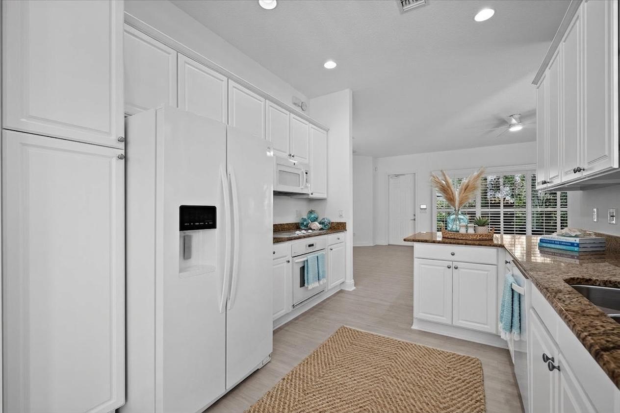 1041 Big Pine Way Jupiter, FL 33458 - Photo 10 of 44 Alternate View of Kithen to Living Area