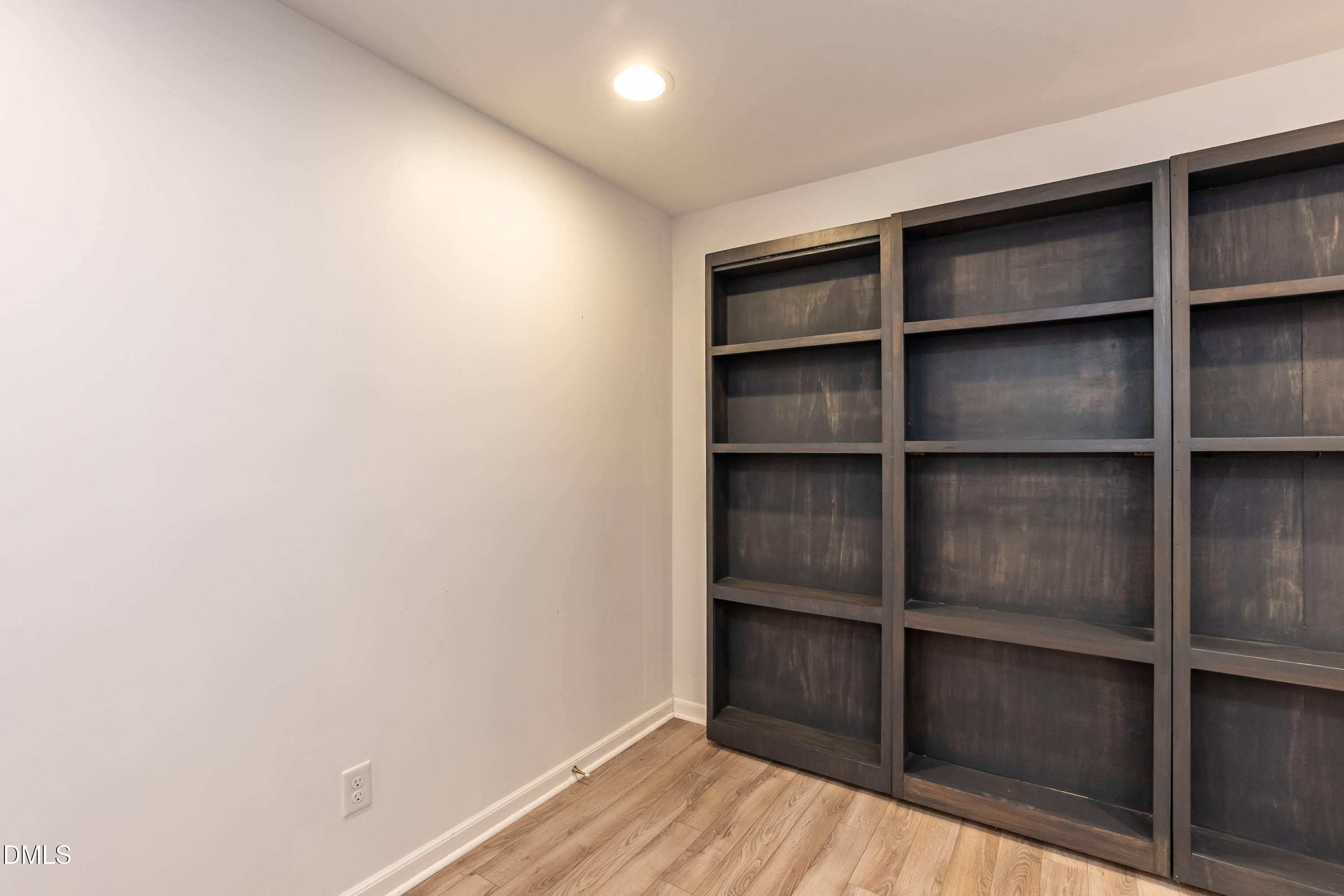 7728 Wakebrook Drive Raleigh, NC 27616 - Photo 37 of 62 Bookshelf or Secret room?