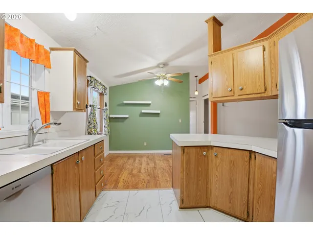 a bathroom with a sink a mirror and a shower