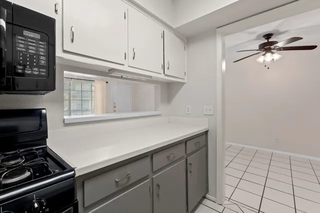 a kitchen with a stove and a microwave