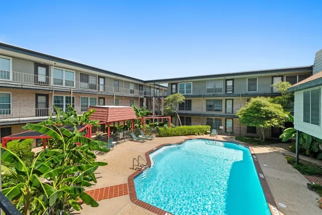 a front view of a house with a yard table and chairs