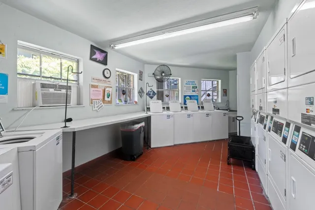 a kitchen with cabinets and window
