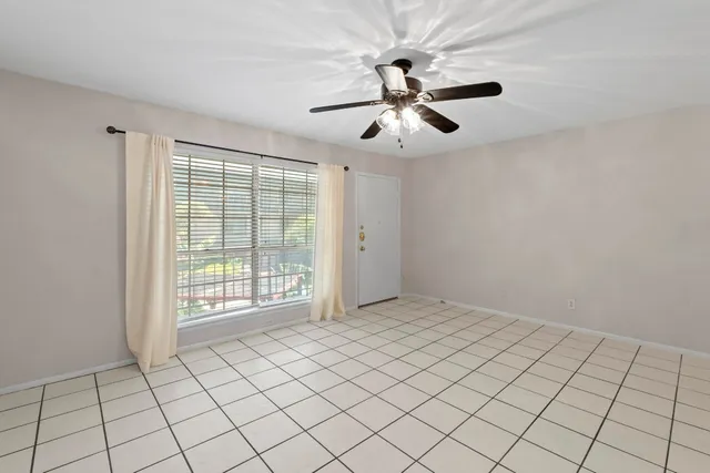 a view of an empty room and window