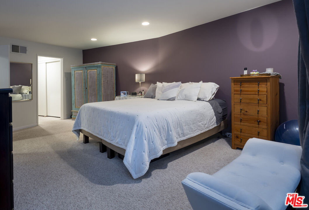 11687 Bellagio Road, Unit 3 Los Angeles, CA 90049 - Photo 20 of 31 a bedroom with a bed and a couch